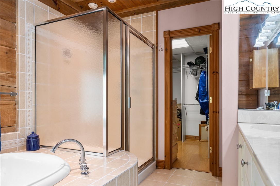 286 B Howell Road Lansing, NC 28643 - Photo 19 of 47 a bathroom with a sink and a mirror