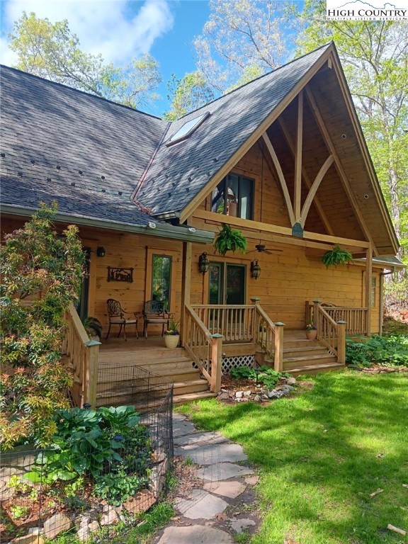286 B Howell Road Lansing, NC 28643 - Photo 2 of 47 a front view of a house with garden