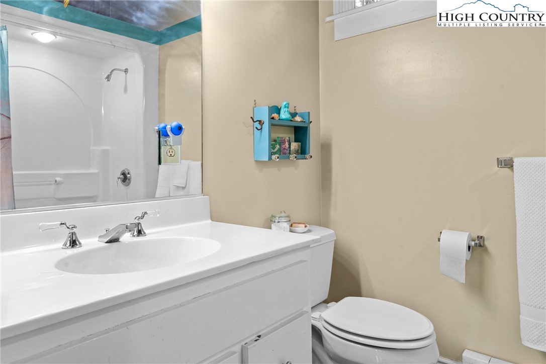 286 B Howell Road Lansing, NC 28643 - Photo 28 of 47 a bathroom with a sink a toilet and shower