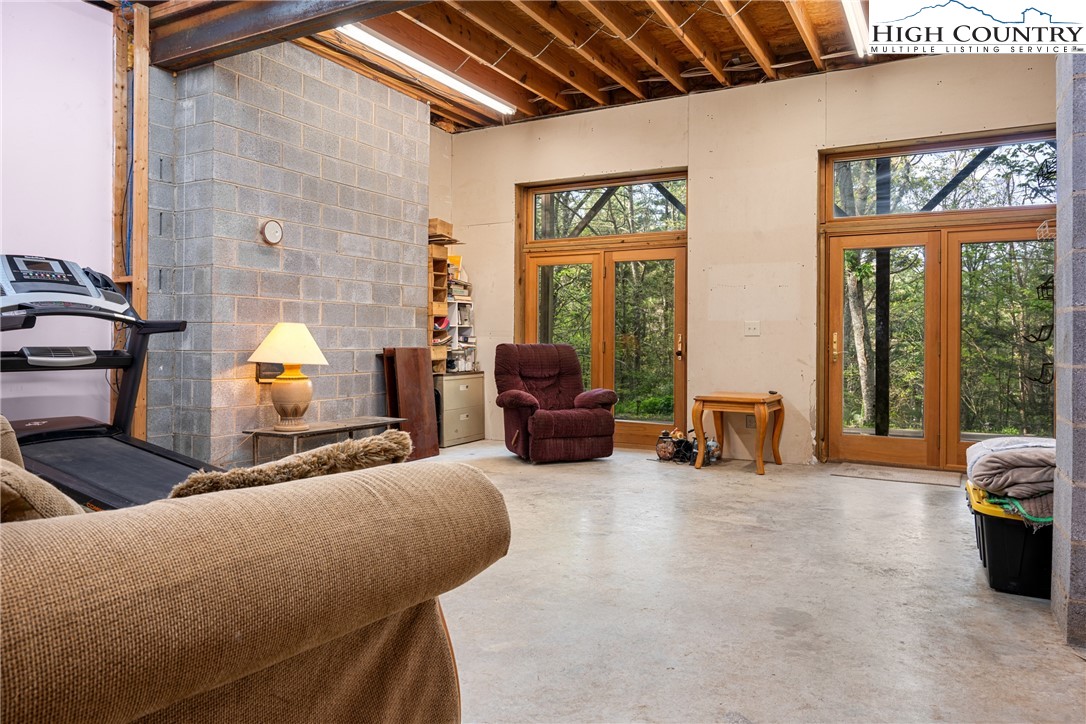 286 B Howell Road Lansing, NC 28643 - Photo 29 of 47 a living room with furniture and large windows