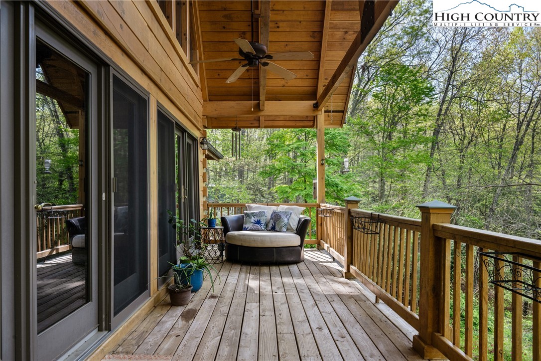 286 B Howell Road Lansing, NC 28643 - Photo 35 of 47 a balcony with furniture and wooden floor