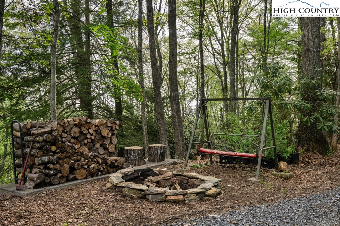 286 B Howell Road Lansing, NC 28643 - Photo 39 of 47 a view of a chairs and table in the outdoor