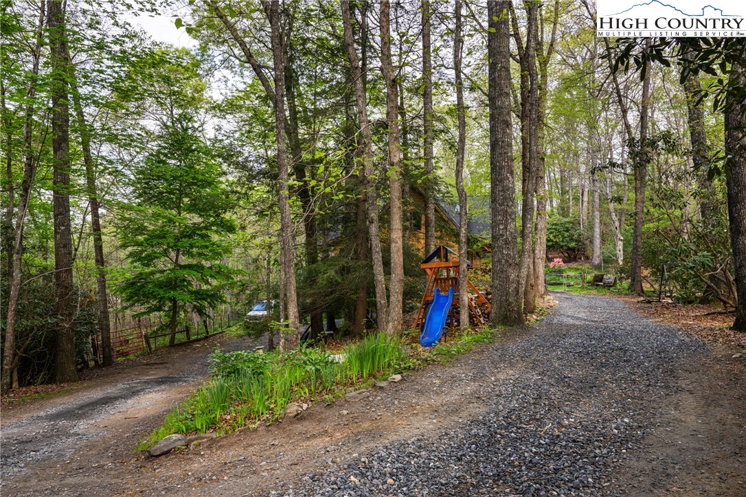 286 B Howell Road Lansing, NC 28643 - Photo 41 of 47 a view of a park with trees and plants