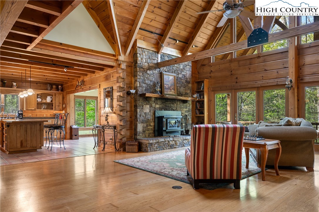 286 B Howell Road Lansing, NC 28643 - Photo 6 of 47 a view of livingroom with furniture fireplace and windows