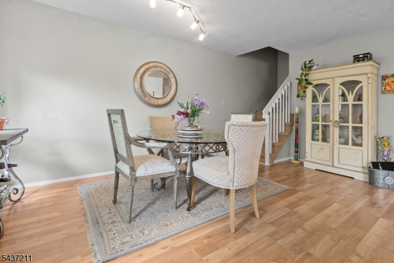 3701 Park Place Springfield, NJ 07081 - Photo 6 of 38 a dining room with furniture and a clock