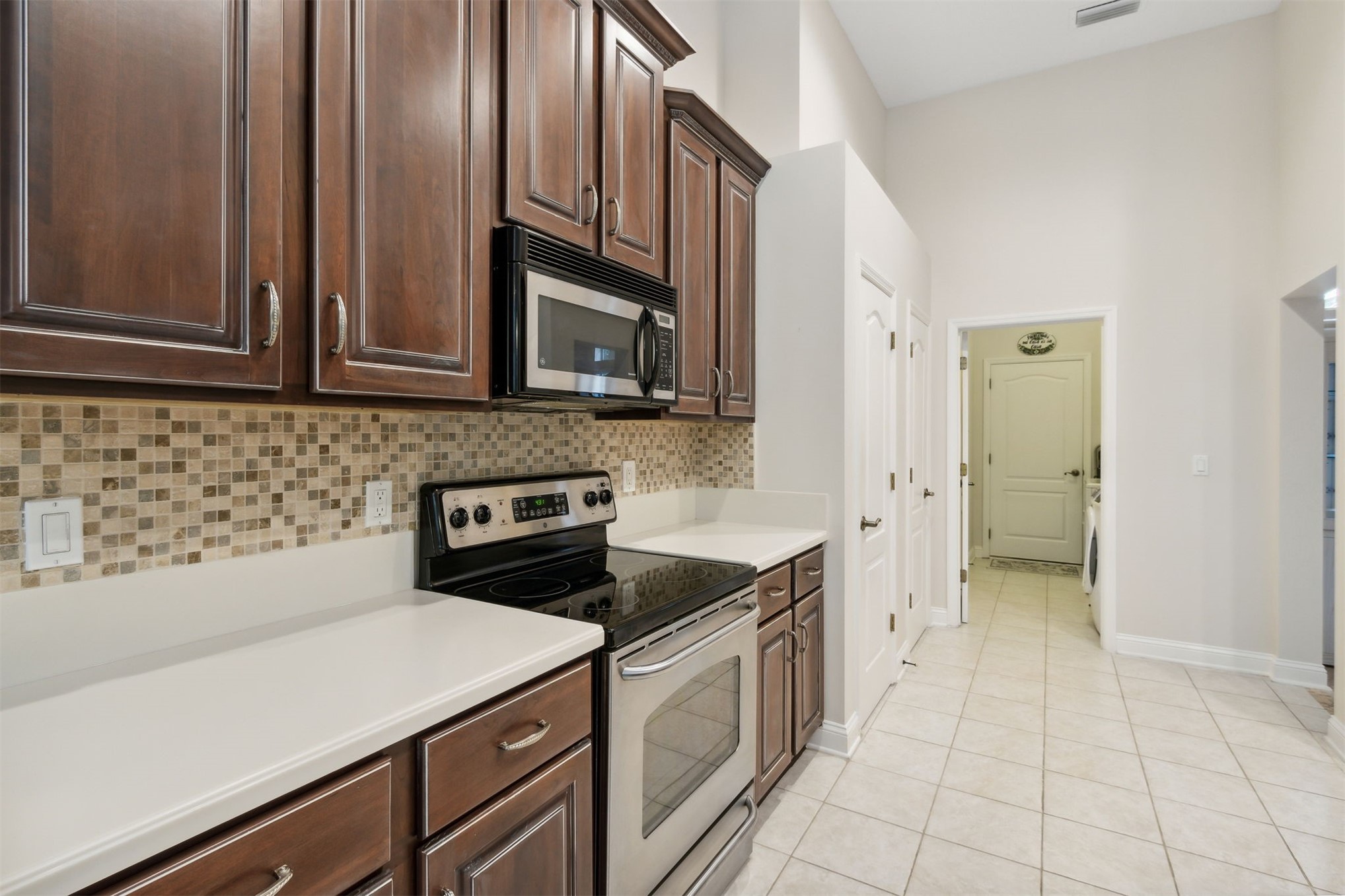 563 Santa Maria Drive Fernandina Beach, FL 32034 - Photo 11 of 26 a kitchen with a sink stove and cabinets