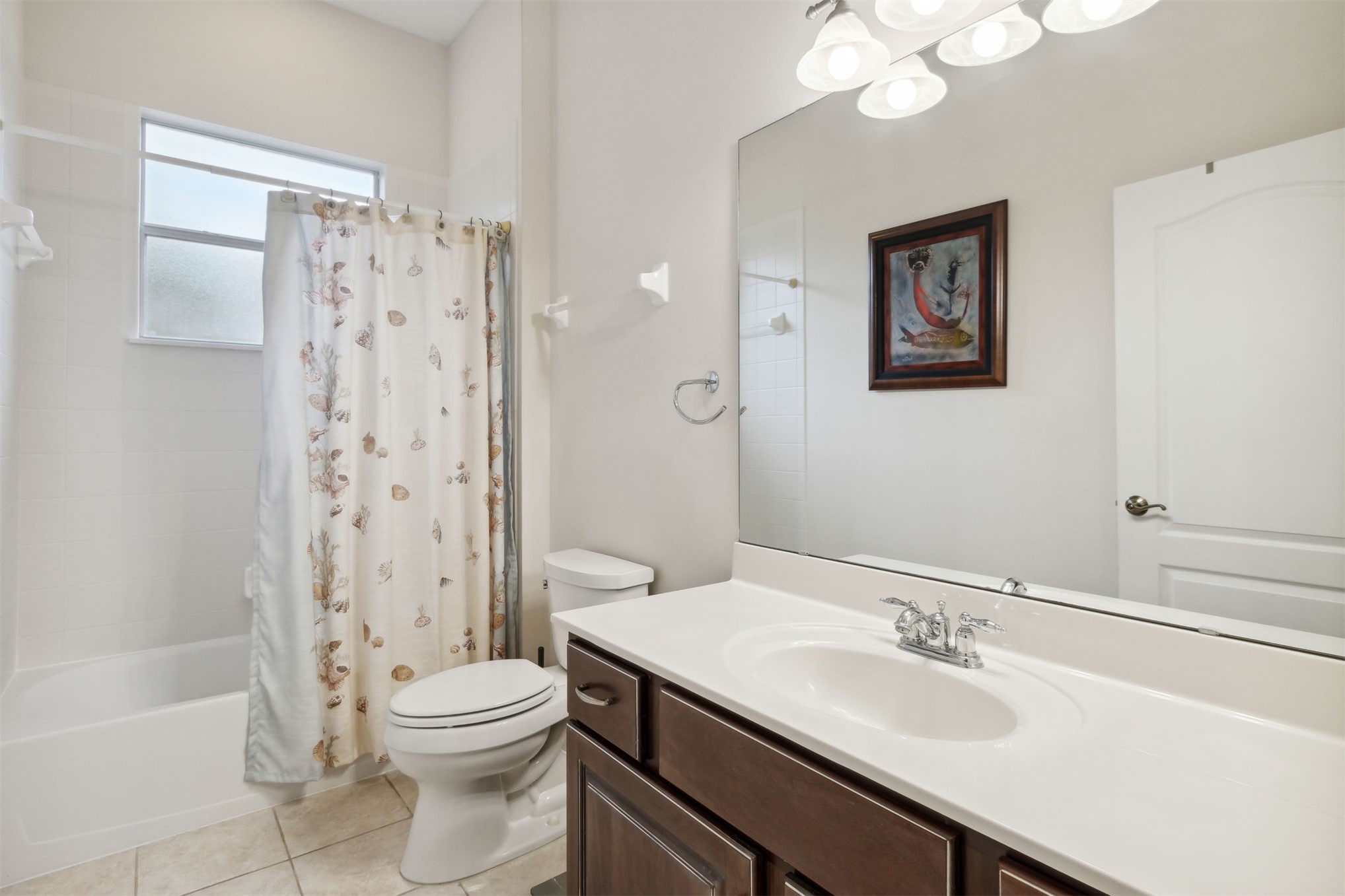 563 Santa Maria Drive Fernandina Beach, FL 32034 - Photo 16 of 26 a bathroom with a granite countertop sink toilet a mirror a vanity and shower