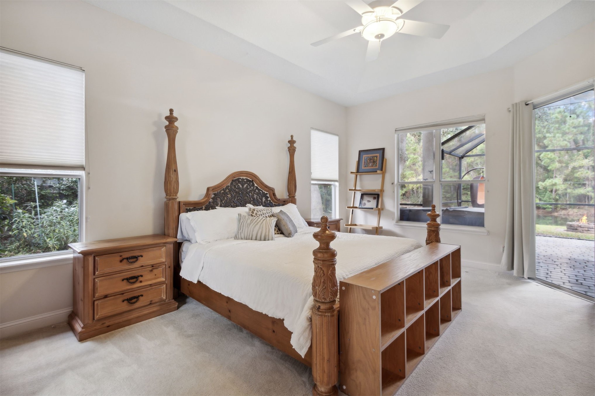 563 Santa Maria Drive Fernandina Beach, FL 32034 - Photo 6 of 26 a spacious bedroom with a bed and a chandelier