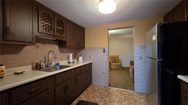a kitchen with a sink and cabinets