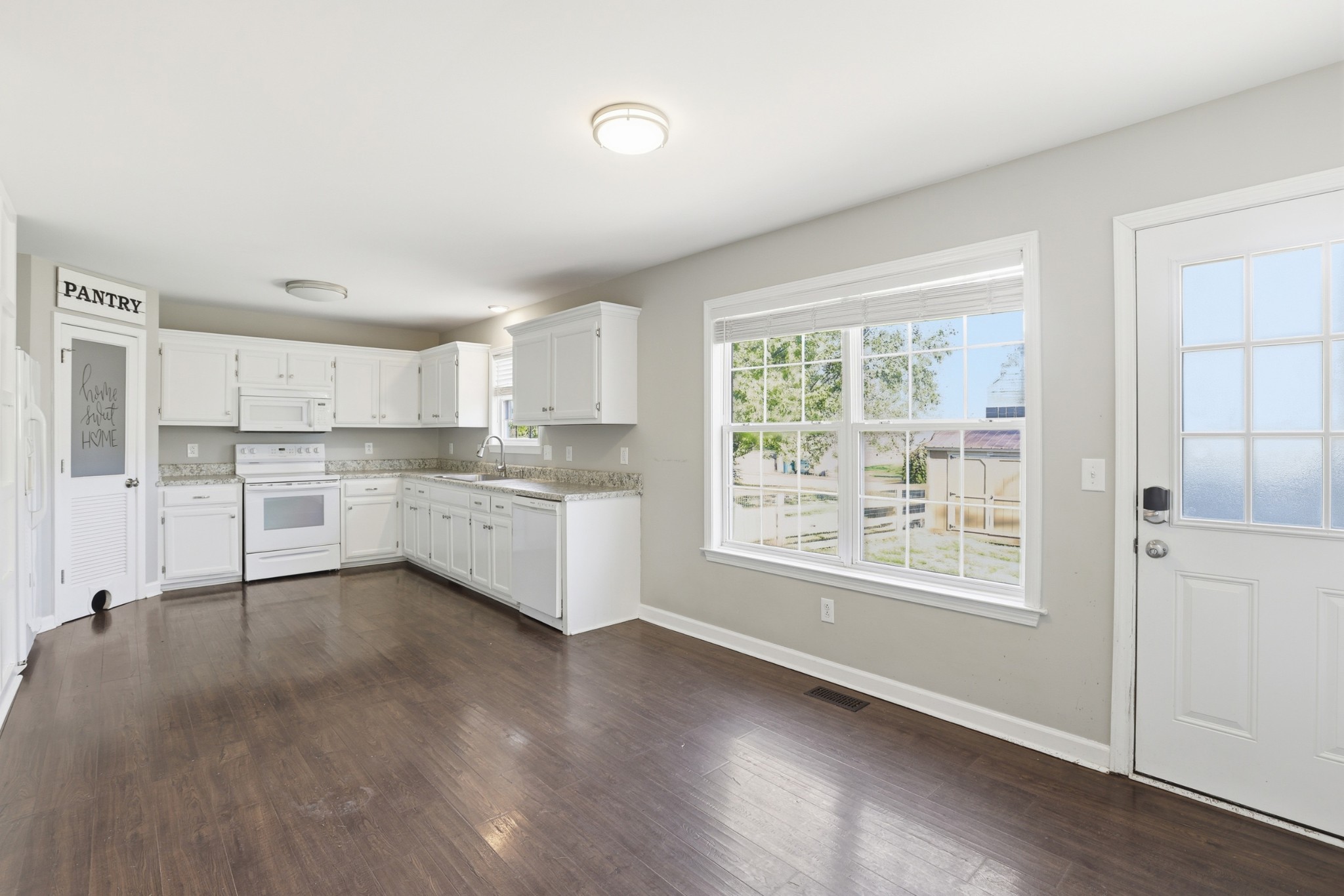 2800 Rippavilla Way Spring Hill, TN 37174 - Photo 14 of 30 a view of a kitchen with wooden floor and electronic appliances