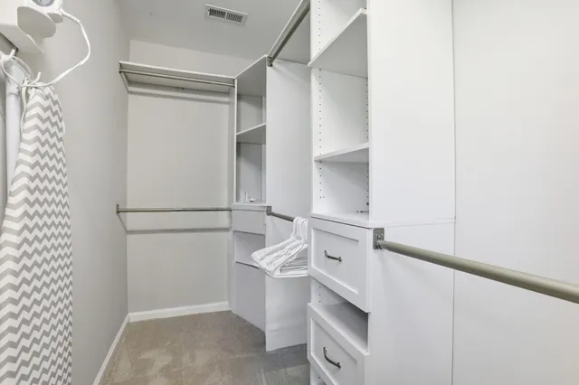 a view of a storage & utility room with racks on the wall