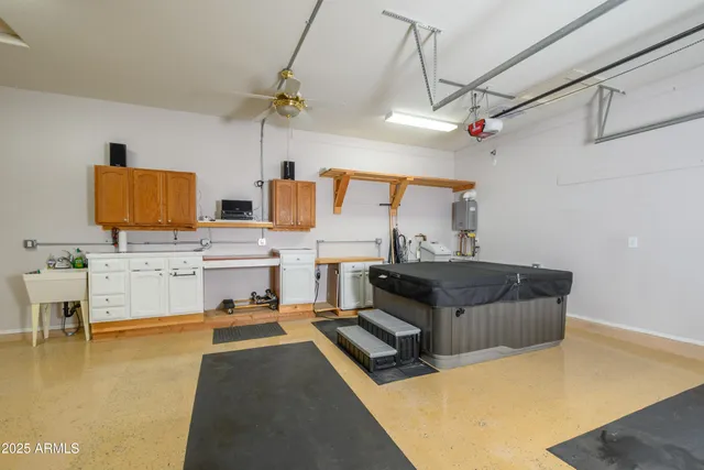 a living room with stainless steel appliances kitchen island granite countertop furniture and a kitchen view