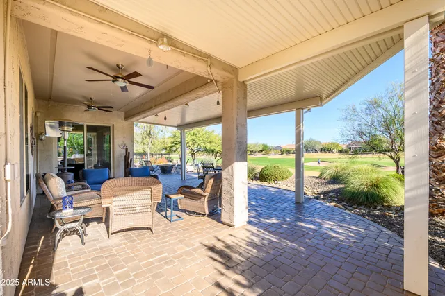 a view of a patio with a backyard