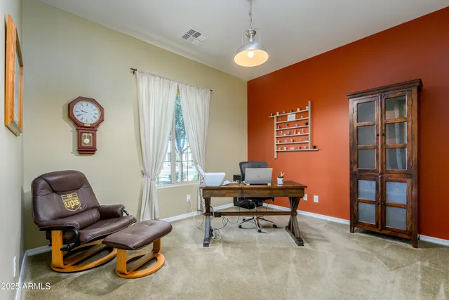 a workspace with furniture and window