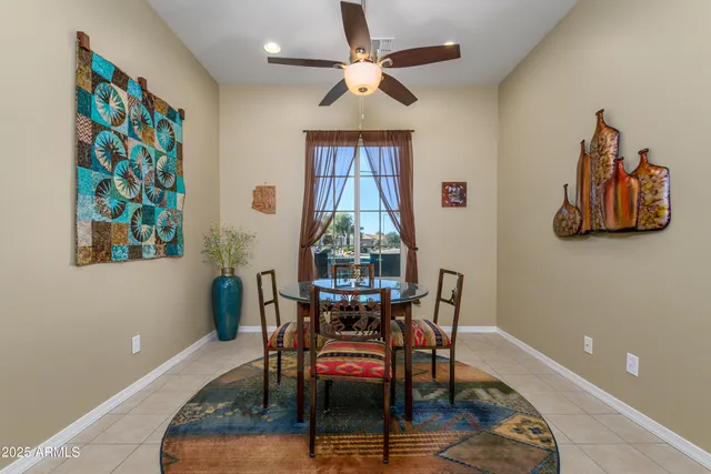 a dining room with furniture and window