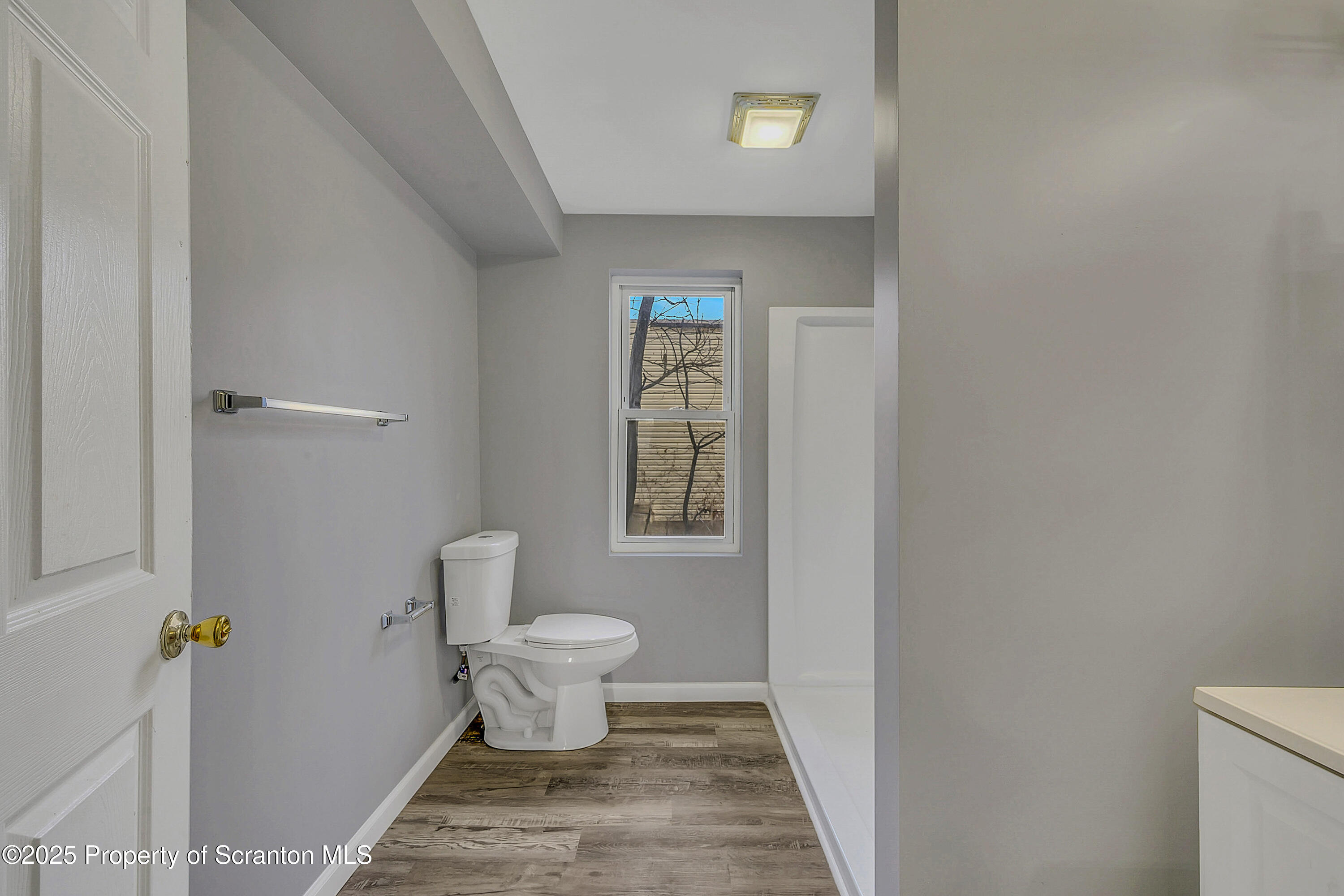 916 West Linden Street, Unit 1 Scranton, PA 18504 - Photo 16 of 19 a bathroom with a toilet and a window