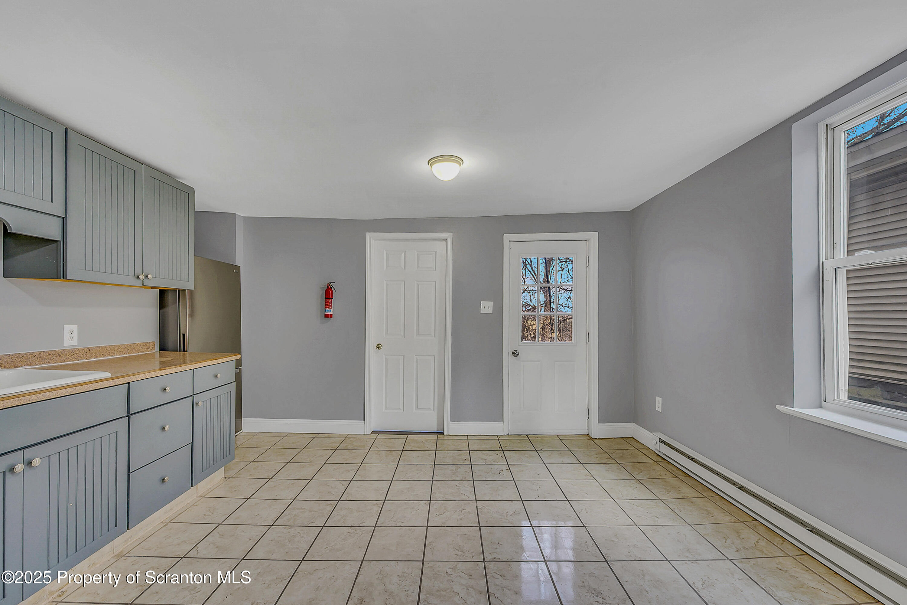 916 West Linden Street, Unit 1 Scranton, PA 18504 - Photo 5 of 19 a view of a kitchen with a sink and a window