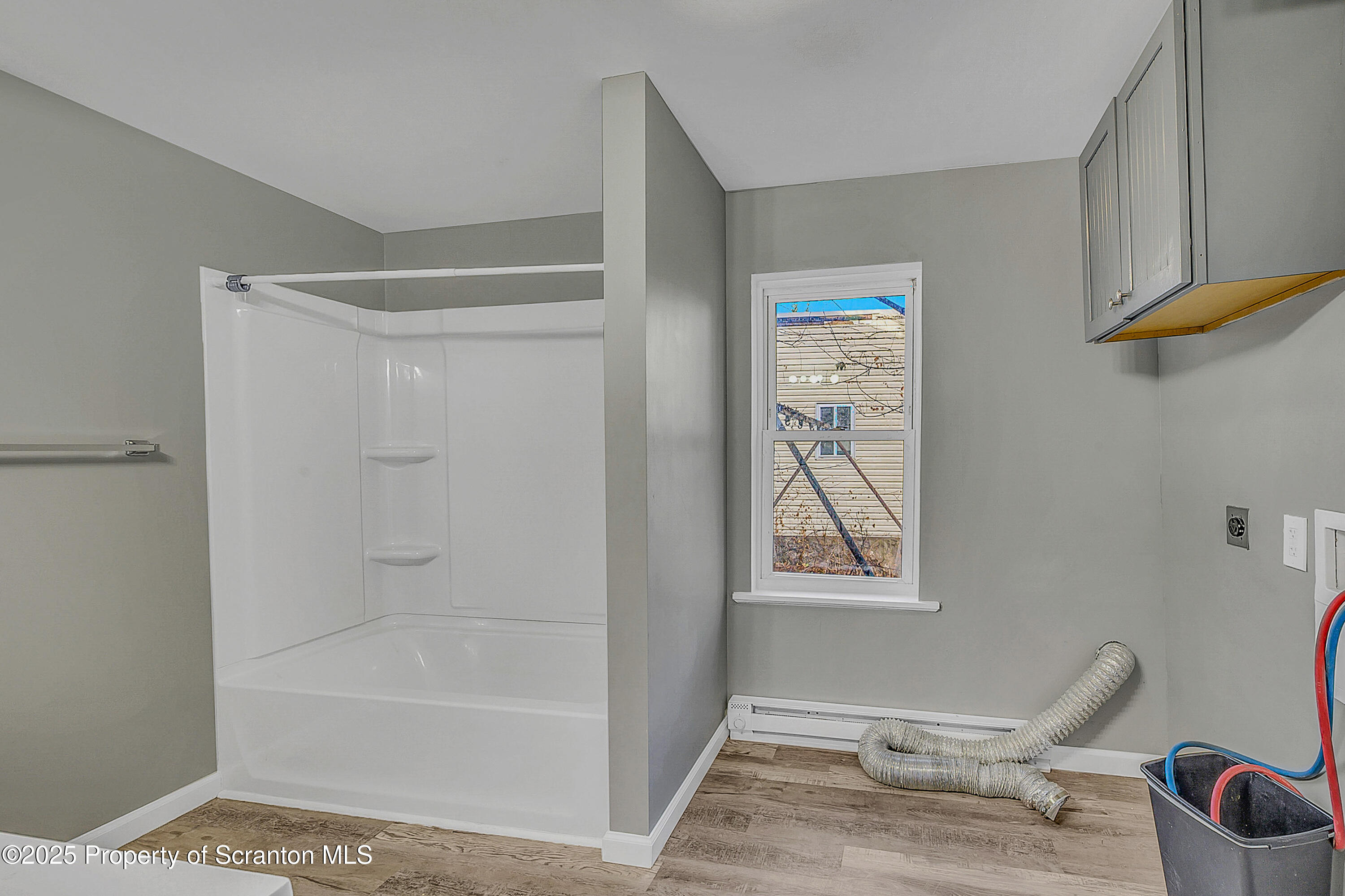 916 West Linden Street, Unit 1 Scranton, PA 18504 - Photo 9 of 19 a bathroom with a bathtub and a shower