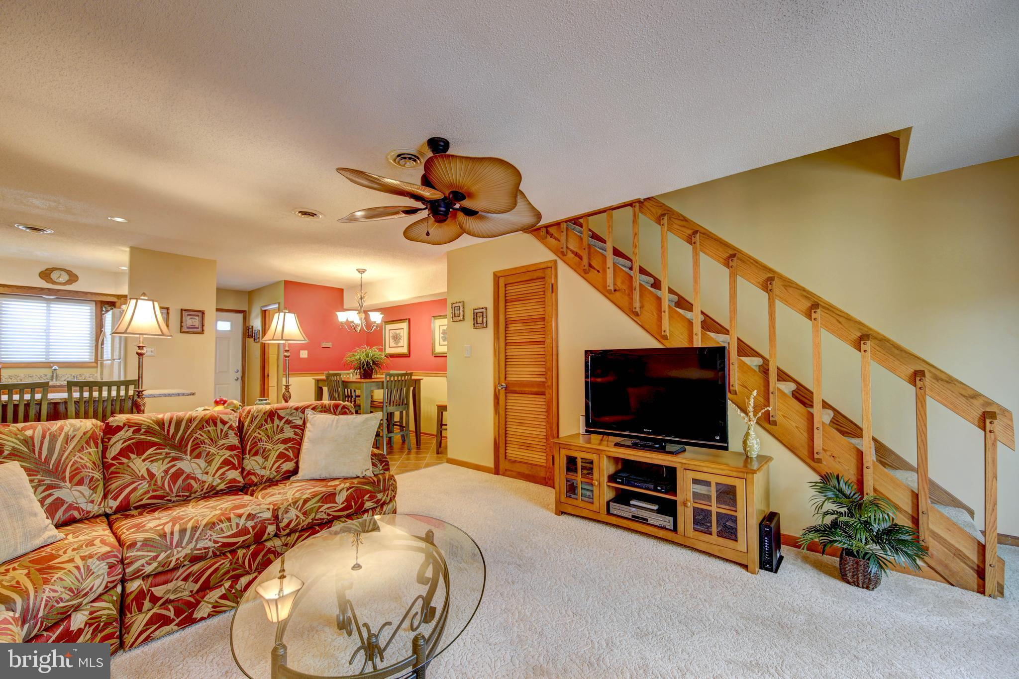 13800 Barge Road, Unit 7 Ocean City, MD 21842 - Photo 15 of 28 Living room with stairs to bedroom