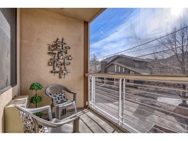 a view of a brick house next to a yard