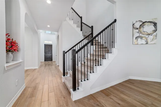 a view of entryway with wooden floor