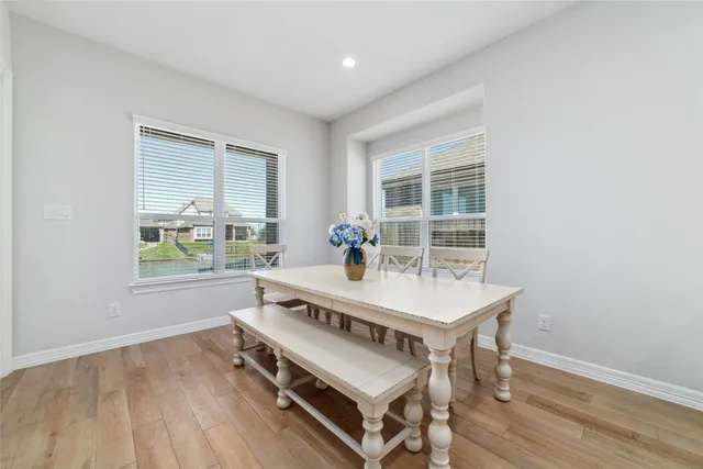 a view of a room with furniture window and wooden floor