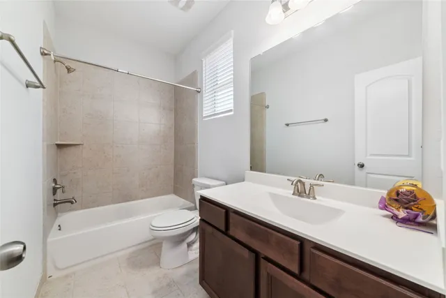 a bathroom with a sink a toilet and a bathtub
