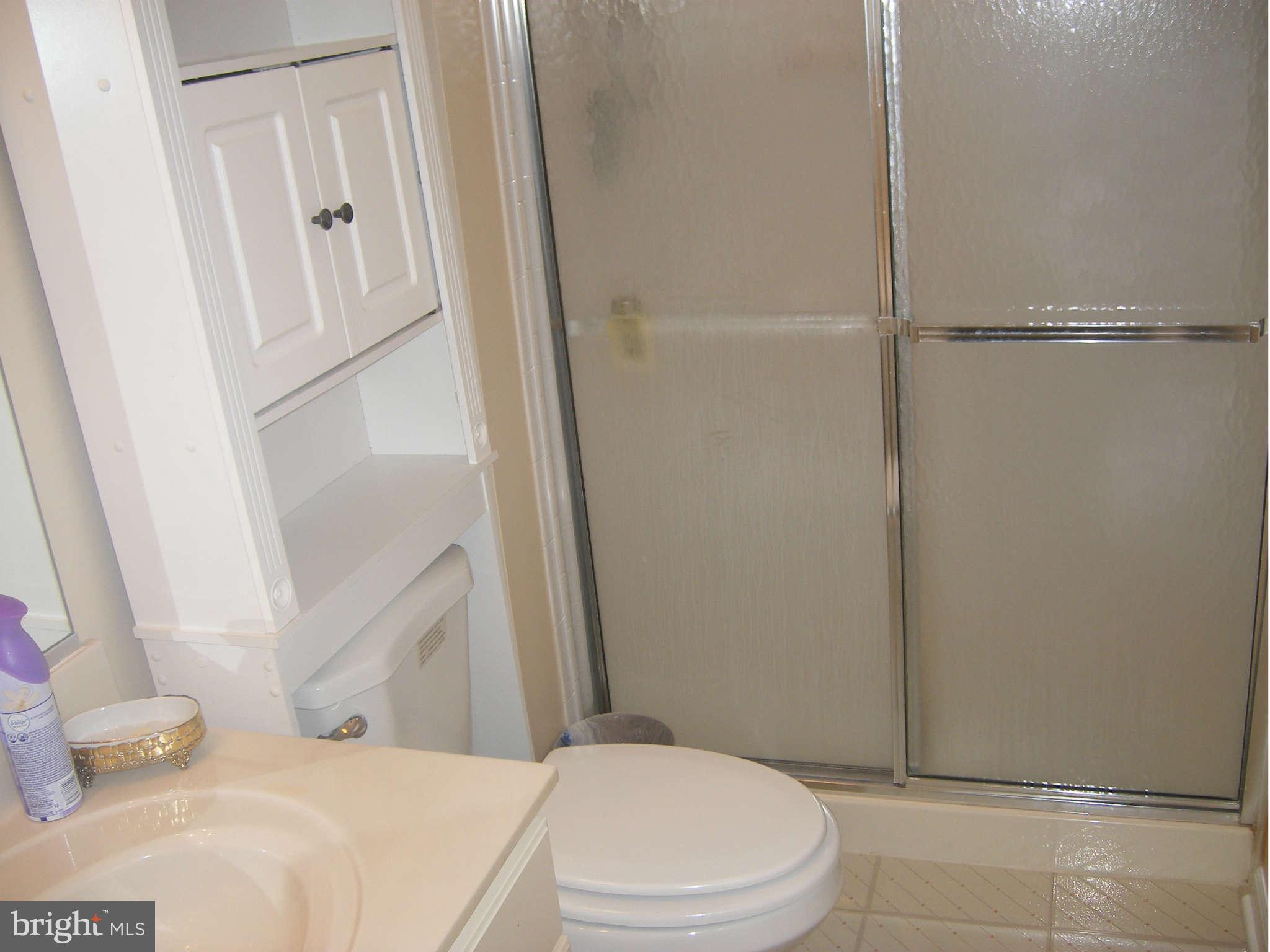 7785 Paddock Way Baltimore, MD 21244 - Photo 13 of 30 a bathroom with a toilet and a shower