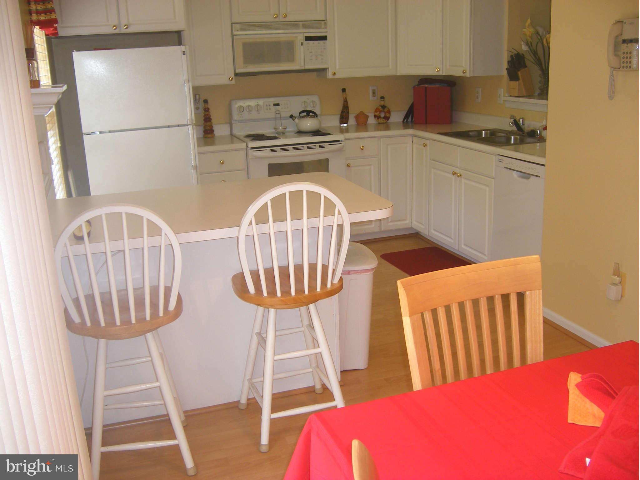 7785 Paddock Way Baltimore, MD 21244 - Photo 24 of 30 a kitchen with stainless steel appliances a stove a sink dishwasher and cabinets