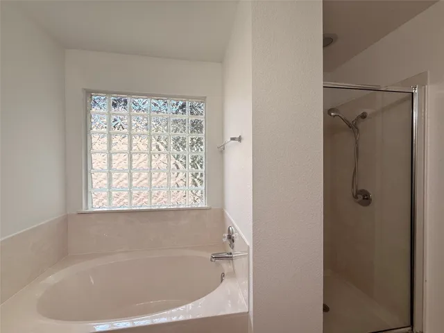 a white bath tub sitting next to a window