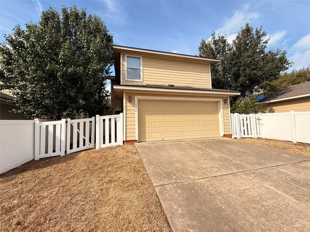 a view of backyard and garage