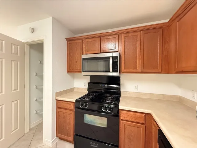 a kitchen with a stove and a microwave