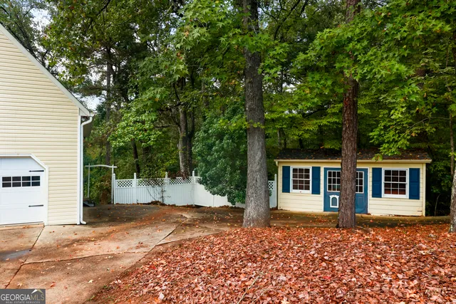 a backyard of a house with seating space