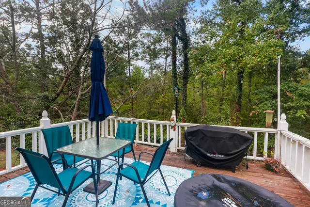 a view of balcony with furniture and wooden deck
