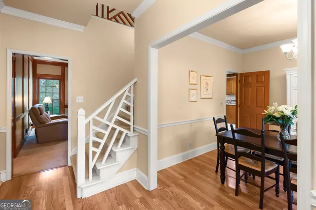 a view of a dining room with furniture and wooden floor