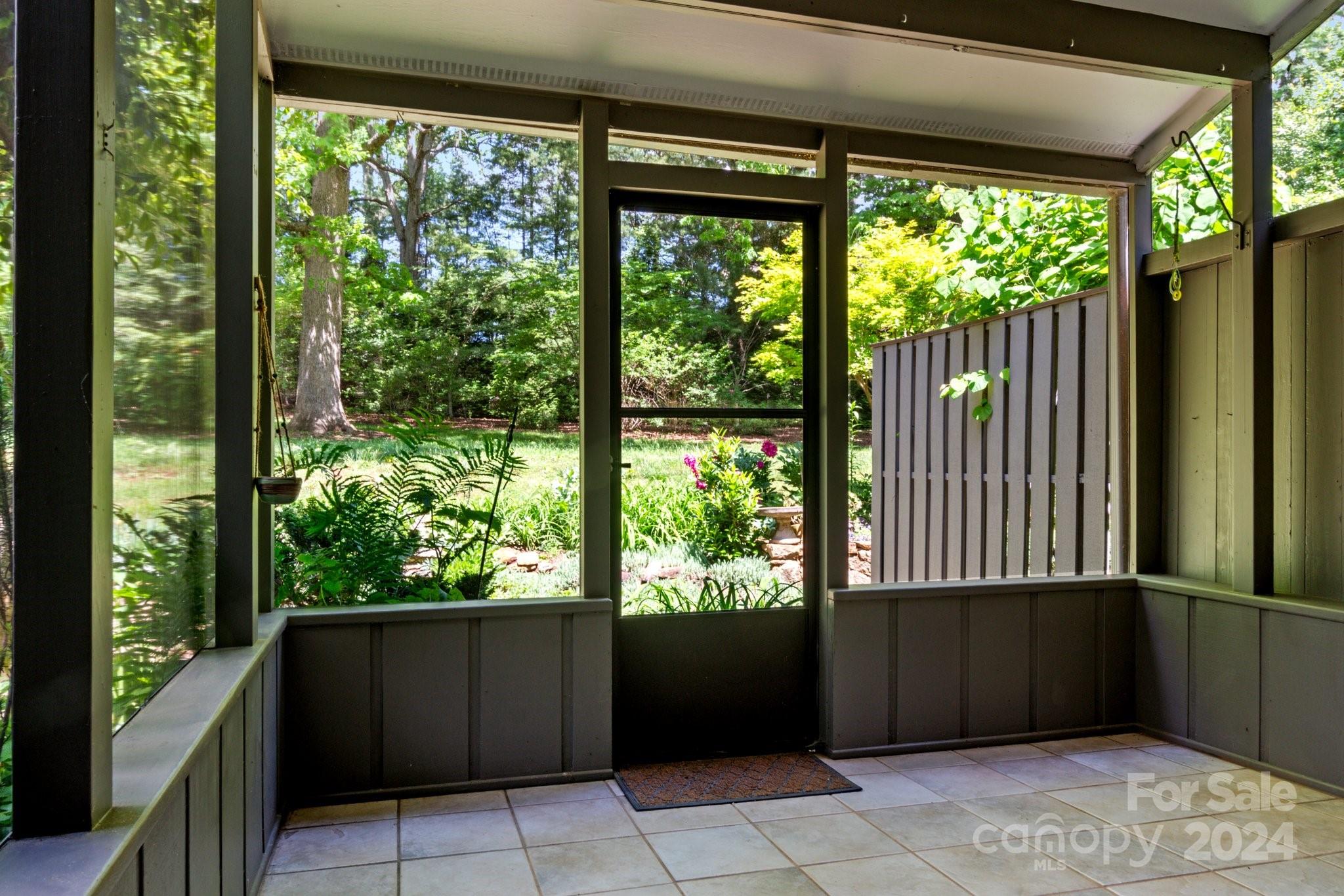 103 Crowfields Drive Asheville, NC 28803 - Photo 11 of 29 a front view of a house with garden