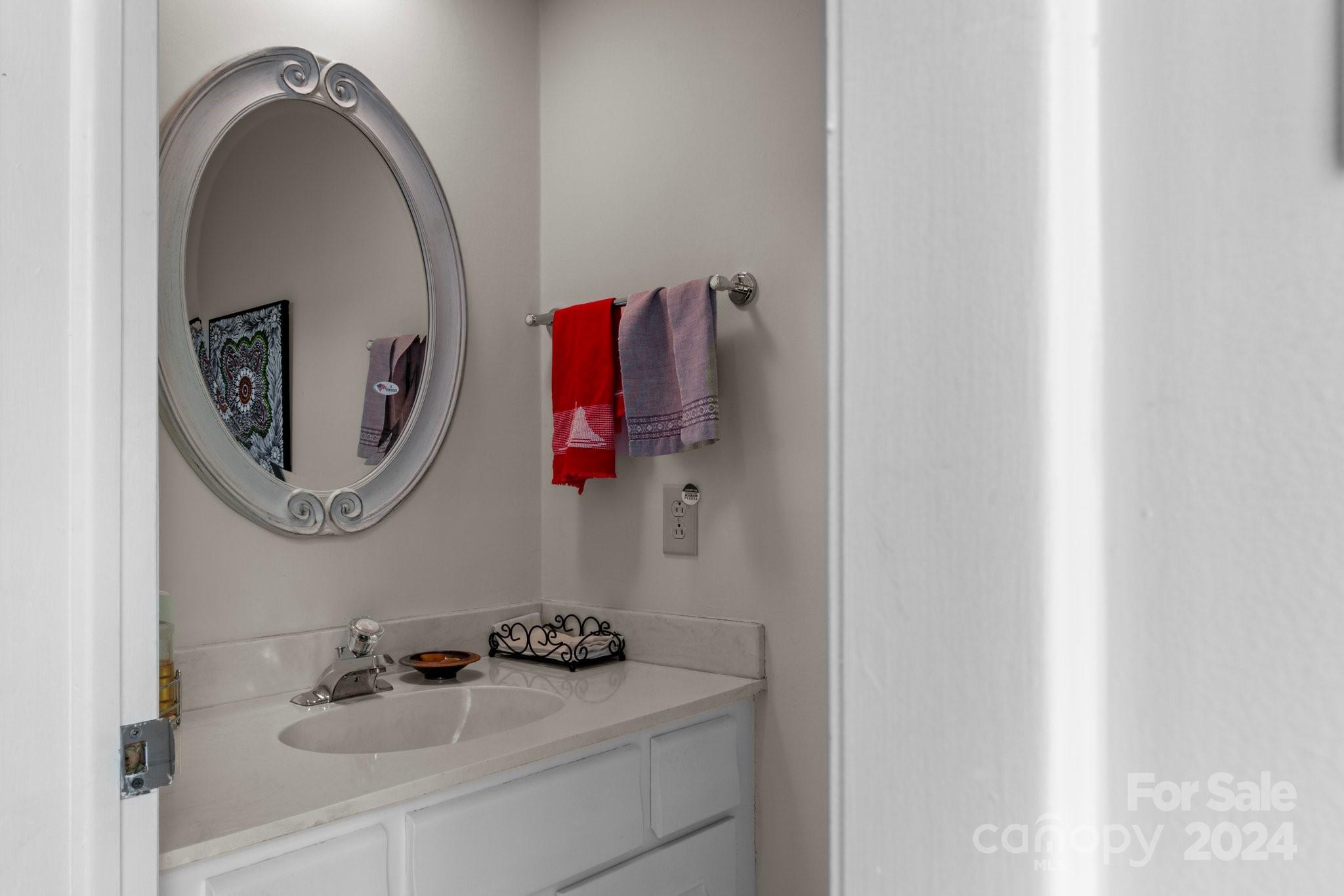 103 Crowfields Drive Asheville, NC 28803 - Photo 13 of 29 a bathroom with a sink and a mirror