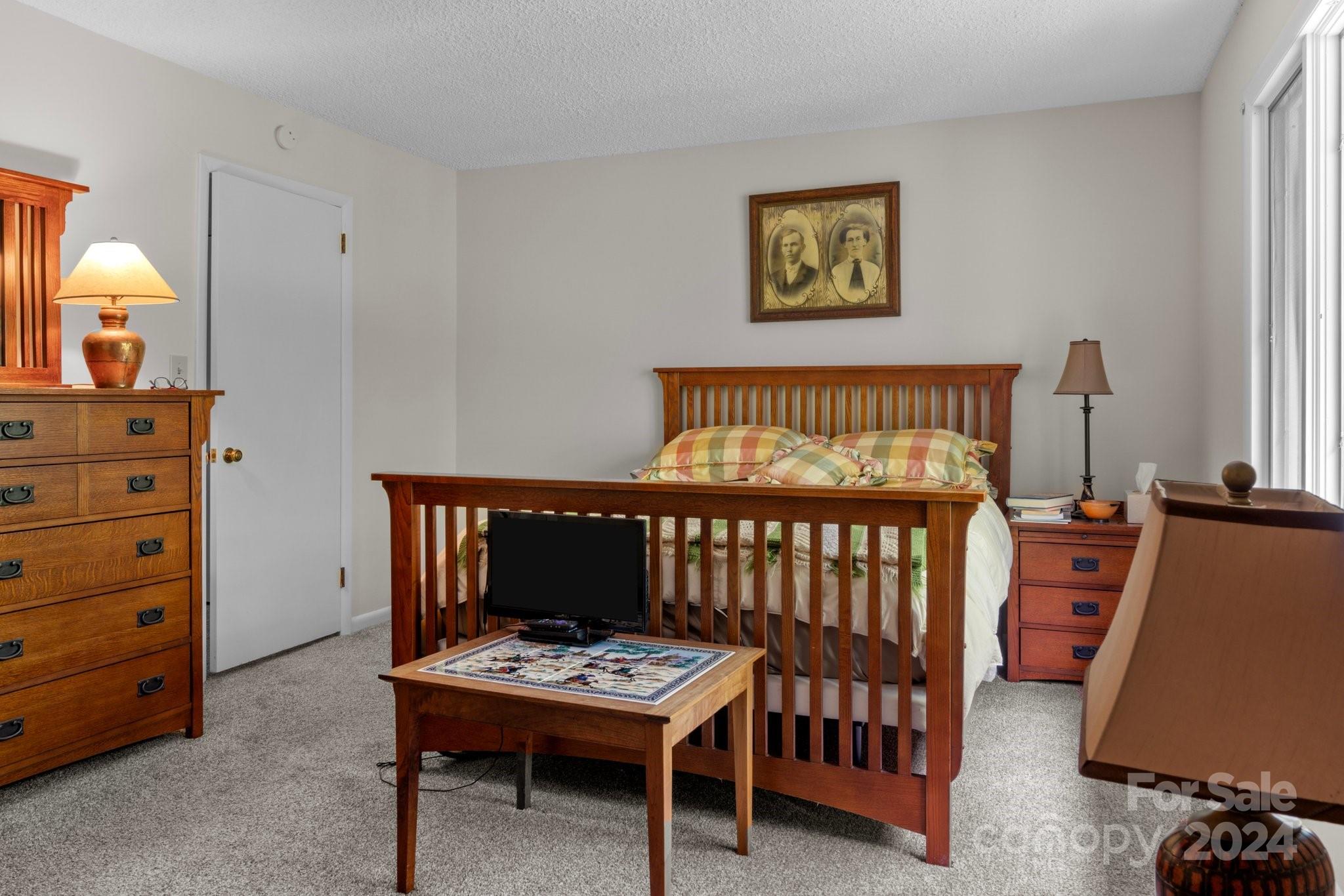 103 Crowfields Drive Asheville, NC 28803 - Photo 16 of 29 a bedroom with furniture and a window