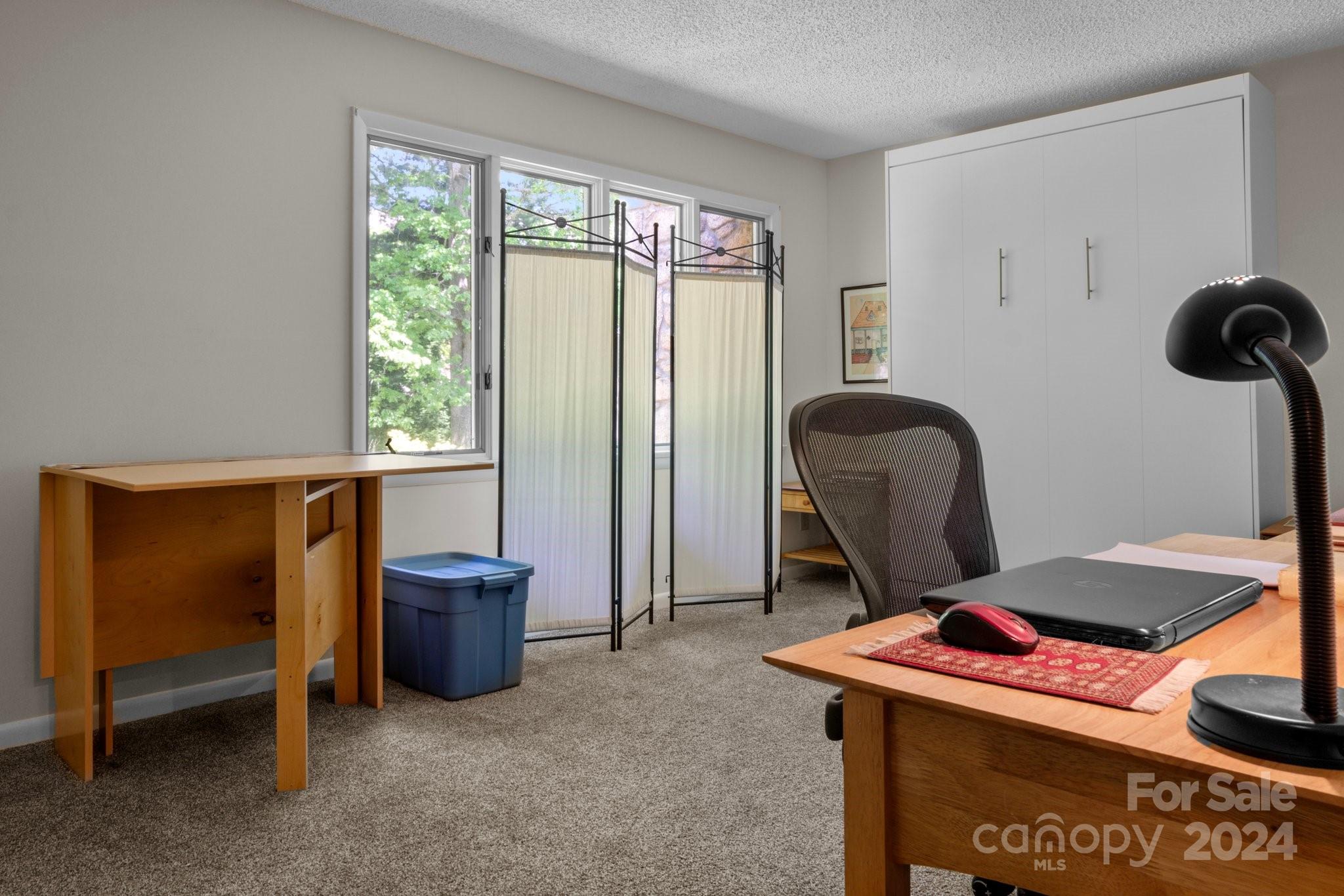 103 Crowfields Drive Asheville, NC 28803 - Photo 19 of 29 a room with furniture and a window