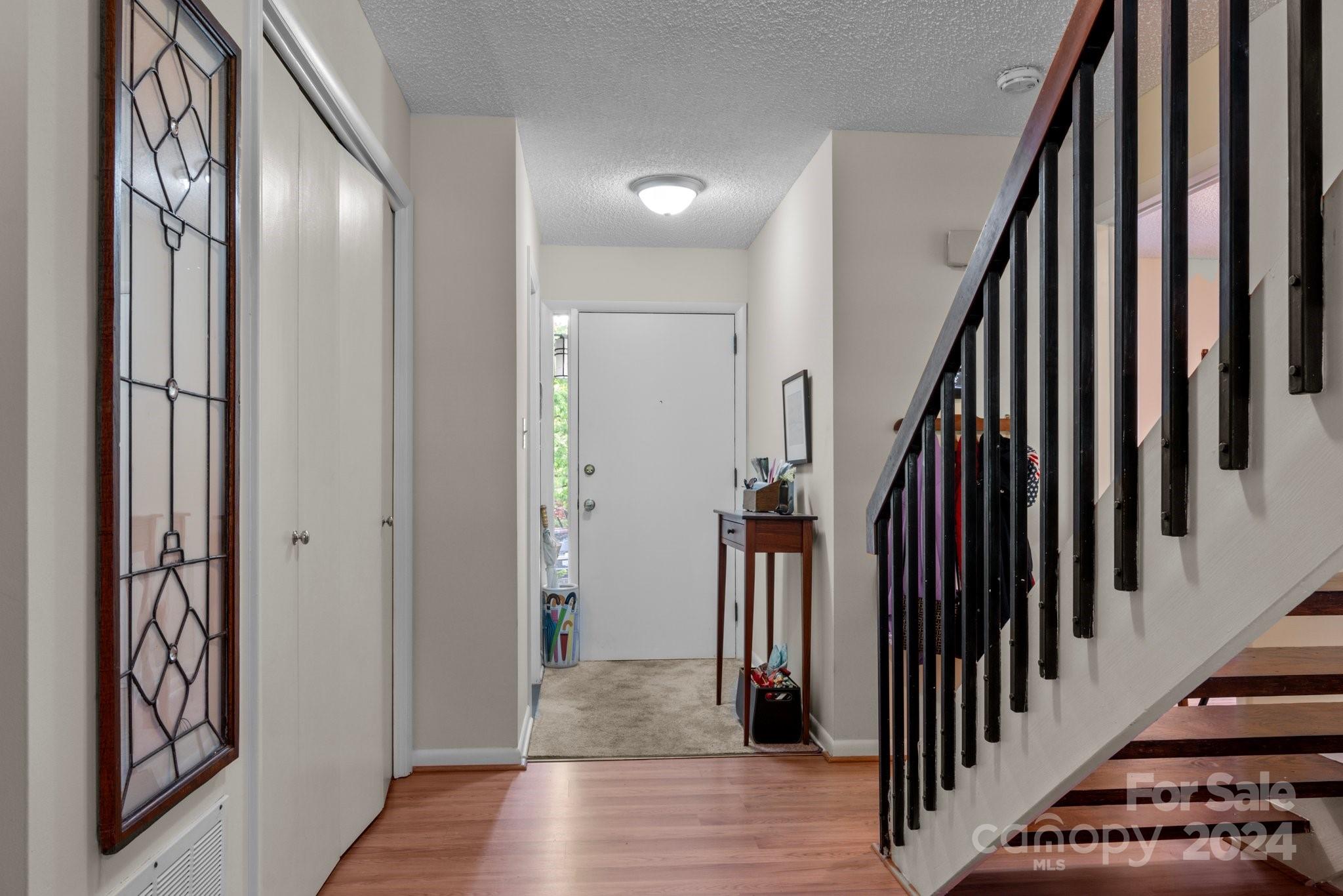 103 Crowfields Drive Asheville, NC 28803 - Photo 2 of 29 a view of an entryway with wooden floor and stairs