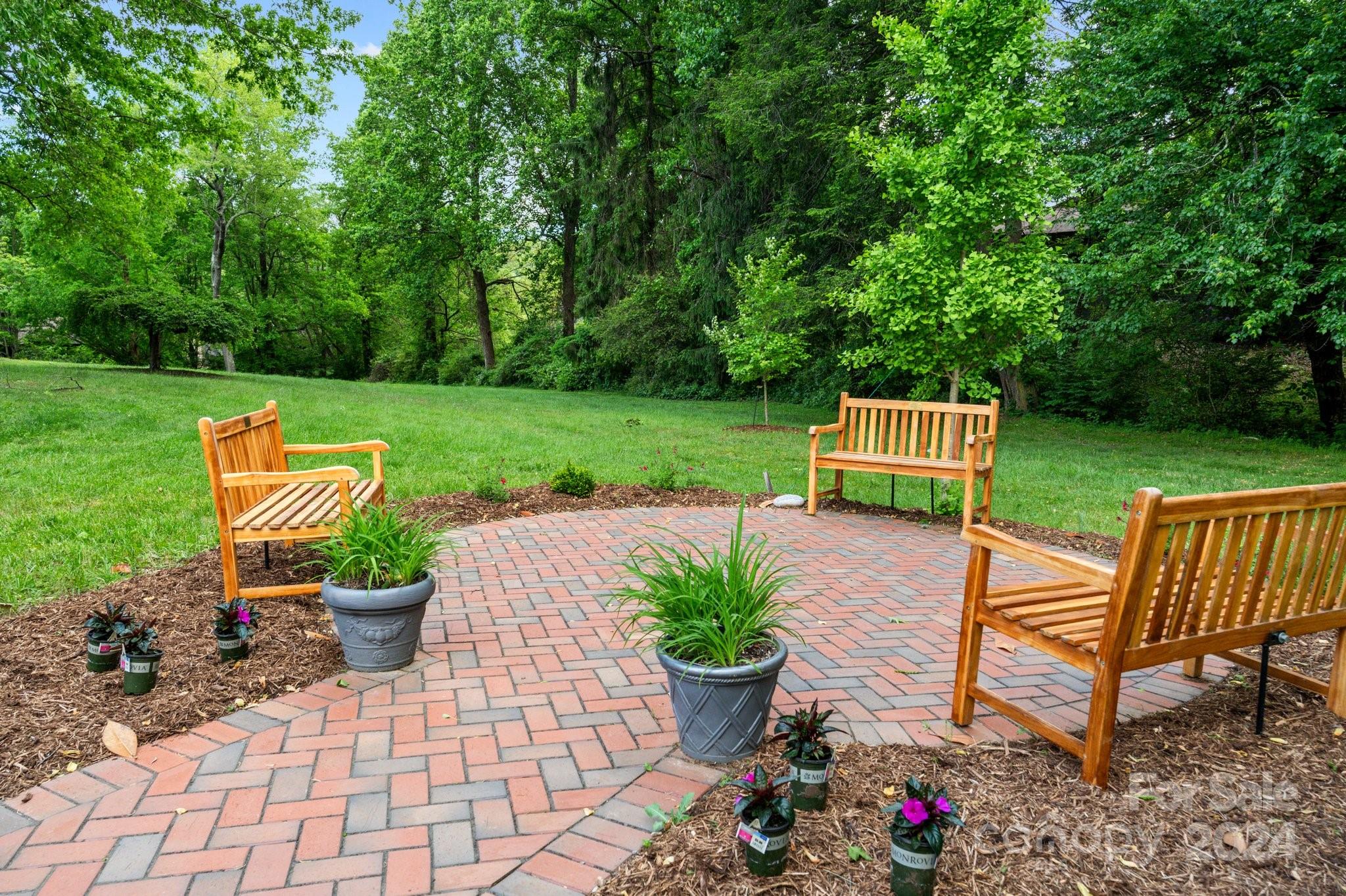 103 Crowfields Drive Asheville, NC 28803 - Photo 21 of 29 a garden view with a seating space
