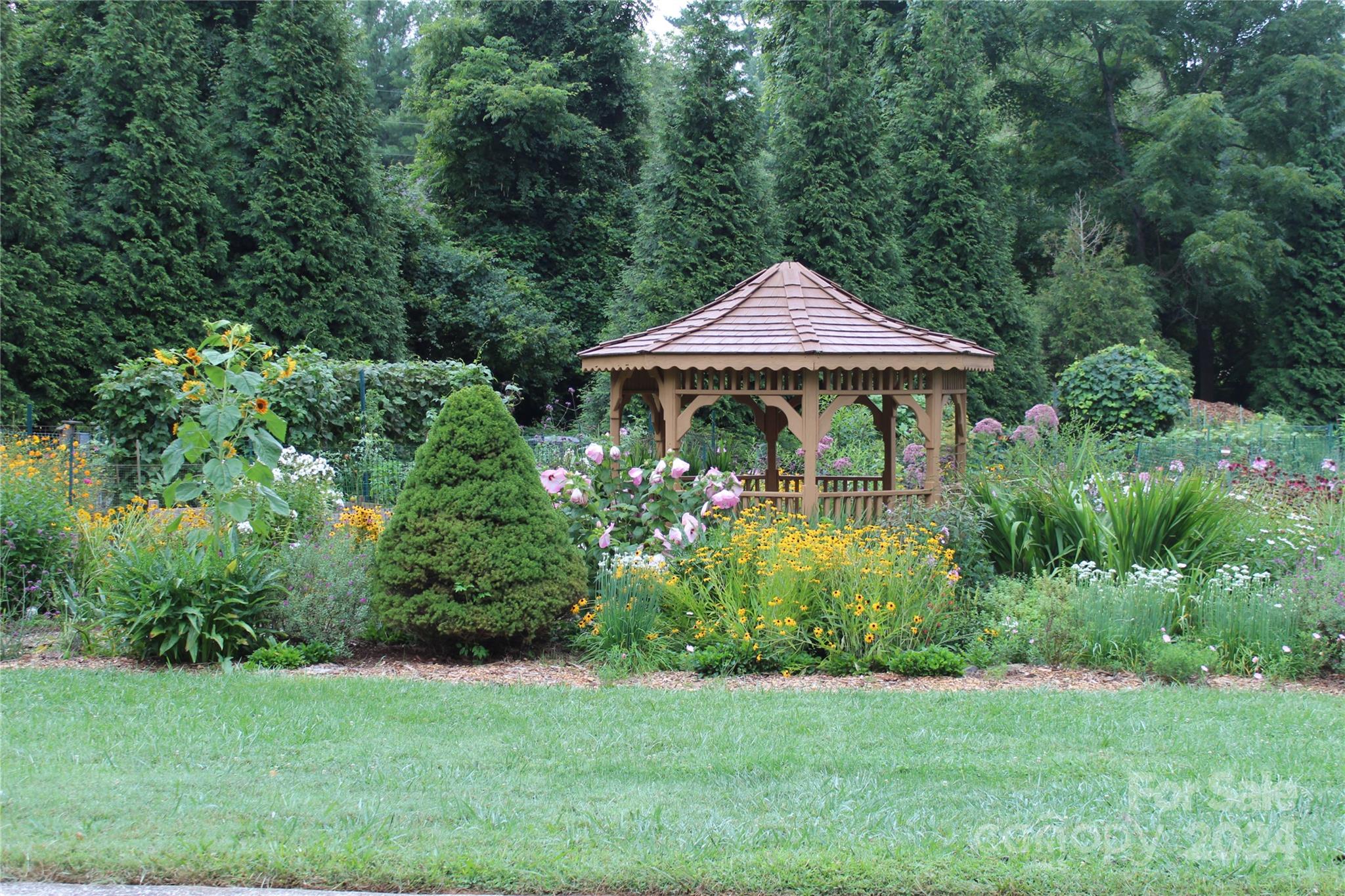 103 Crowfields Drive Asheville, NC 28803 - Photo 27 of 29 a front view of a house with garden