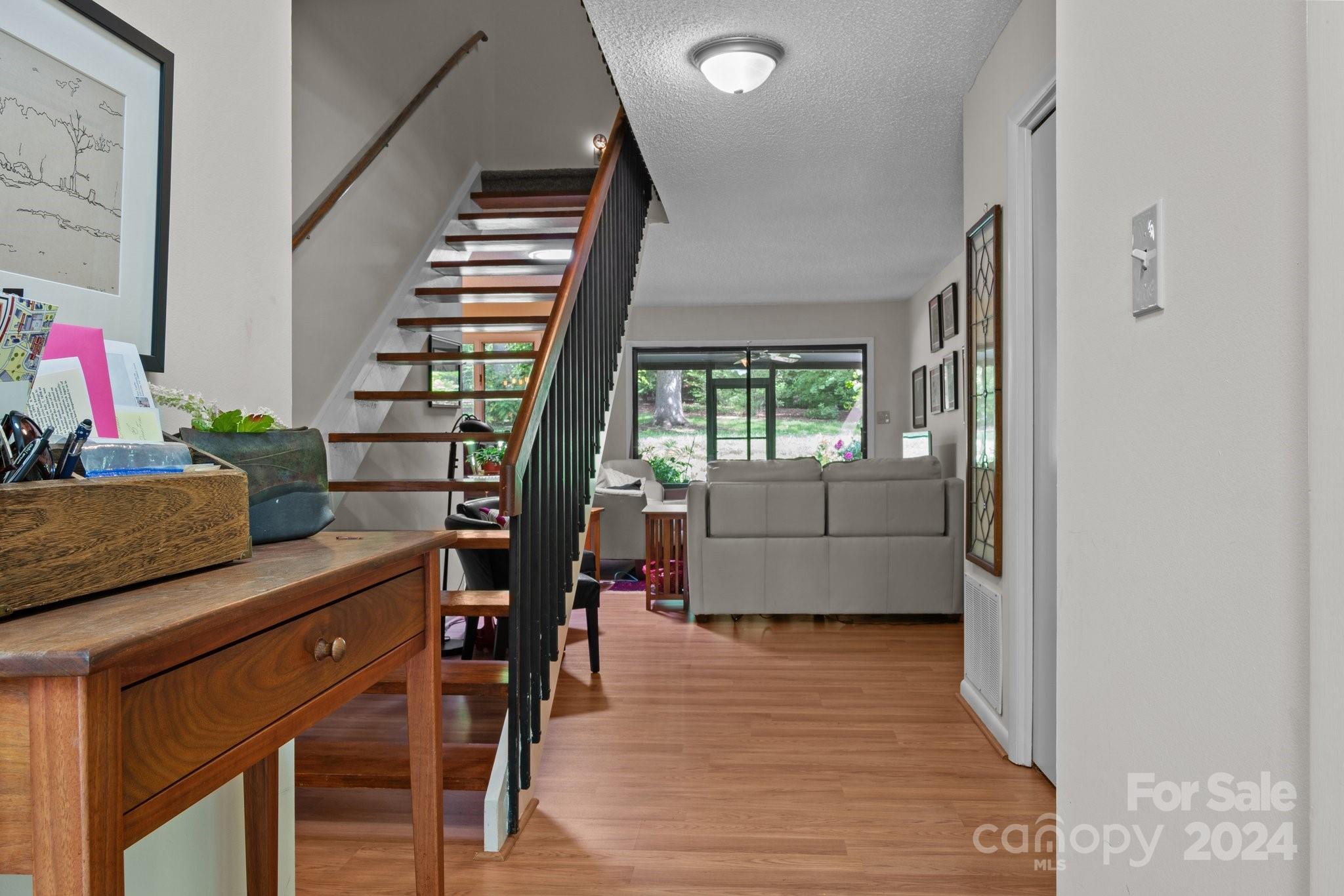 103 Crowfields Drive Asheville, NC 28803 - Photo 3 of 29 a view of entryway and hall with wooden floor
