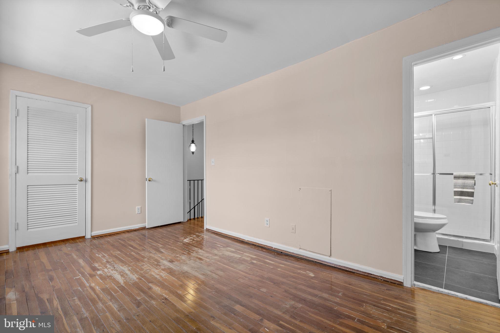 5927 Bayshire Road, Unit 115 Springfield, VA 22152 - Photo 16 of 55 a view of a room with wooden floor and white walls