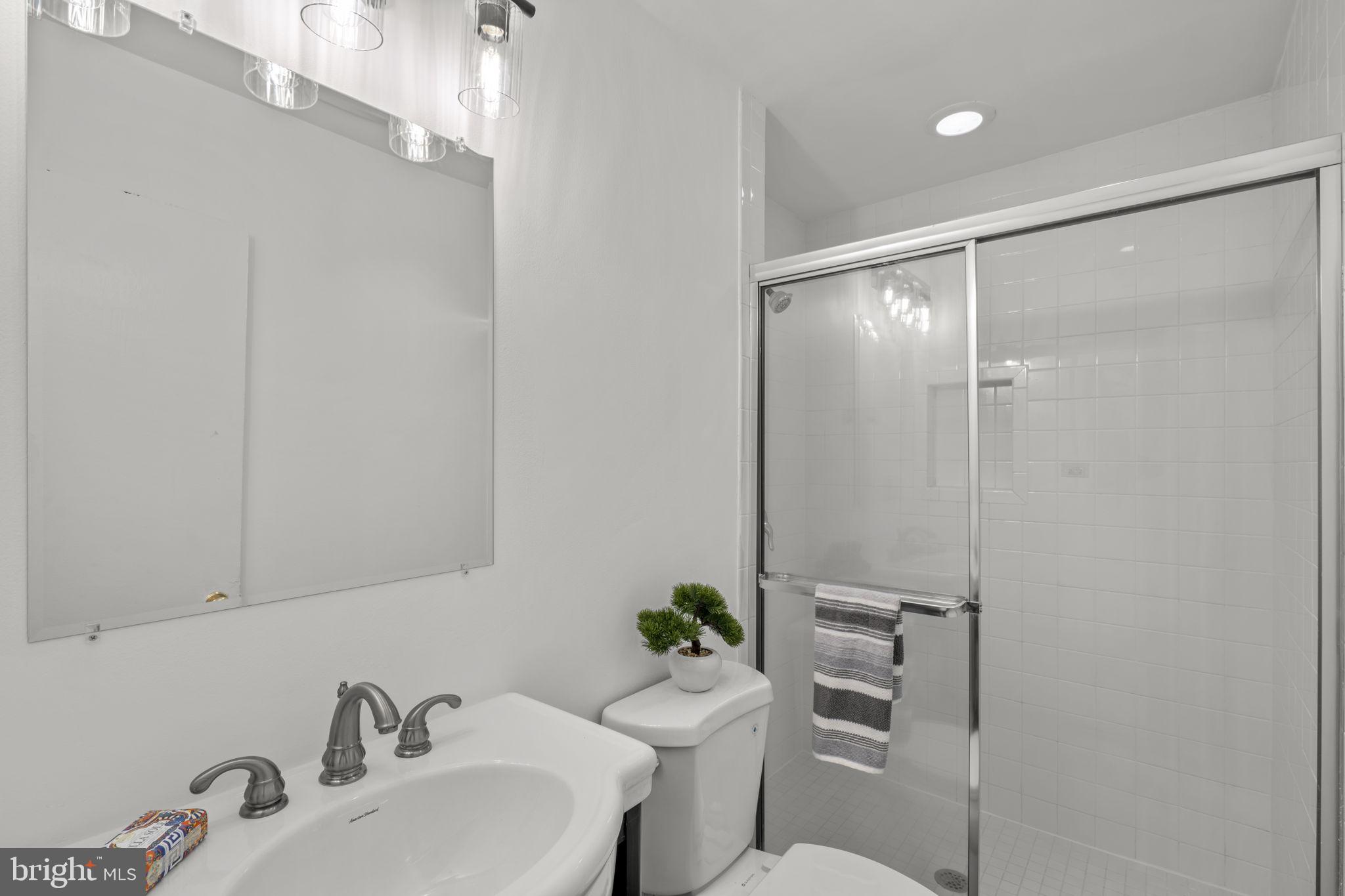 5927 Bayshire Road, Unit 115 Springfield, VA 22152 - Photo 19 of 55 a bathroom with a sink mirror and toilet