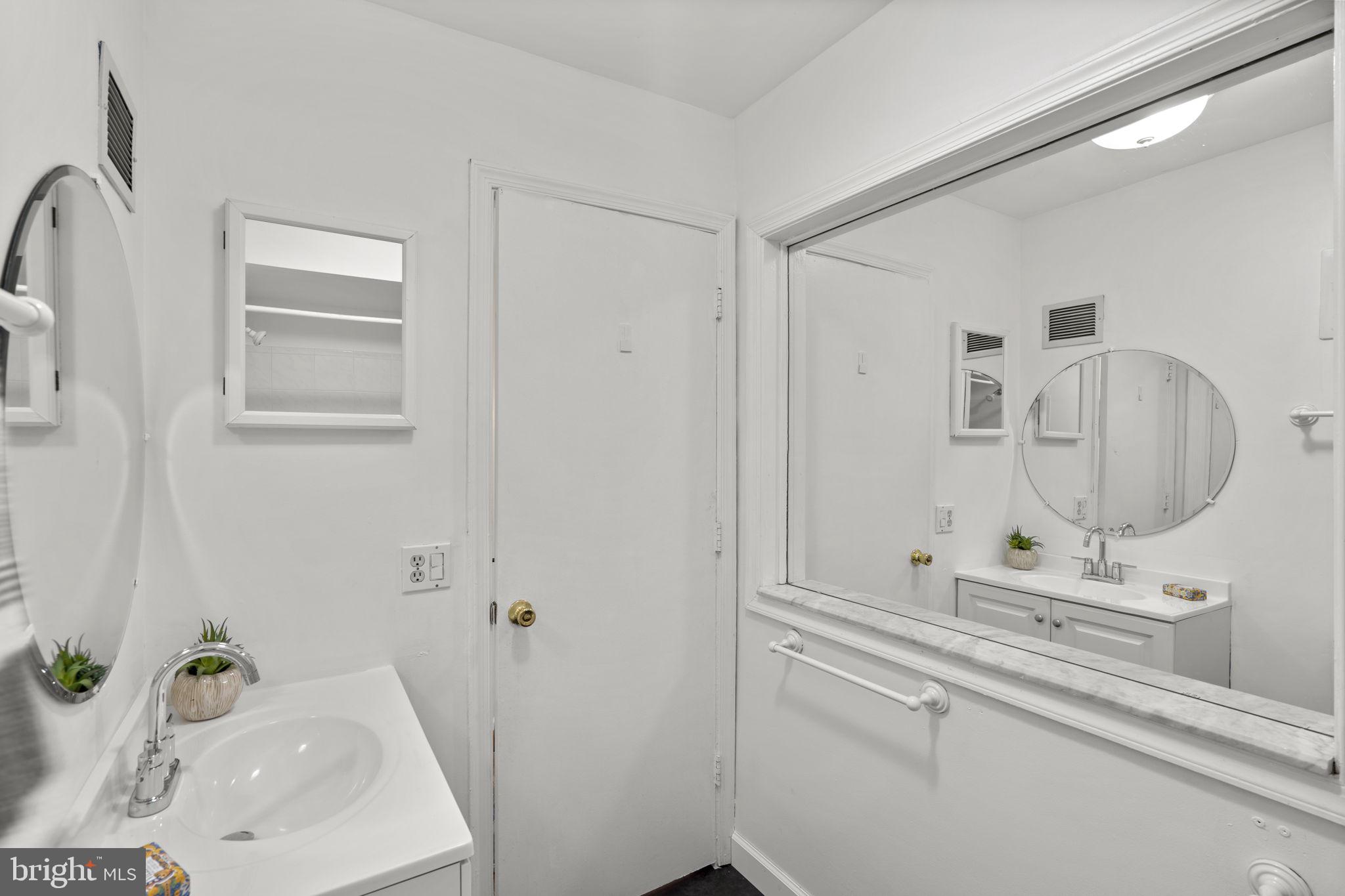 5927 Bayshire Road, Unit 115 Springfield, VA 22152 - Photo 25 of 55 a bathroom with a sink and a mirror