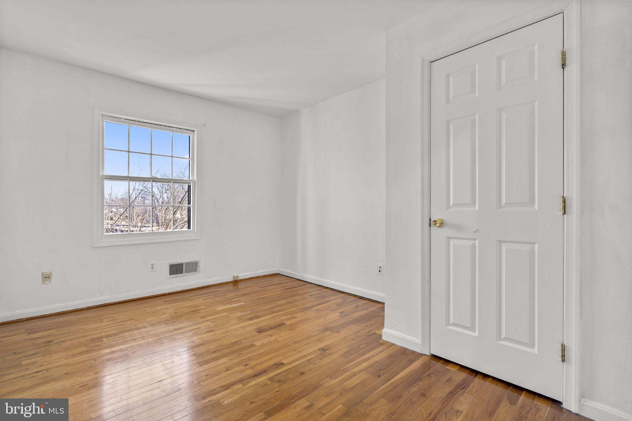 5927 Bayshire Road, Unit 115 Springfield, VA 22152 - Photo 26 of 55 a view of an empty room with wooden floor