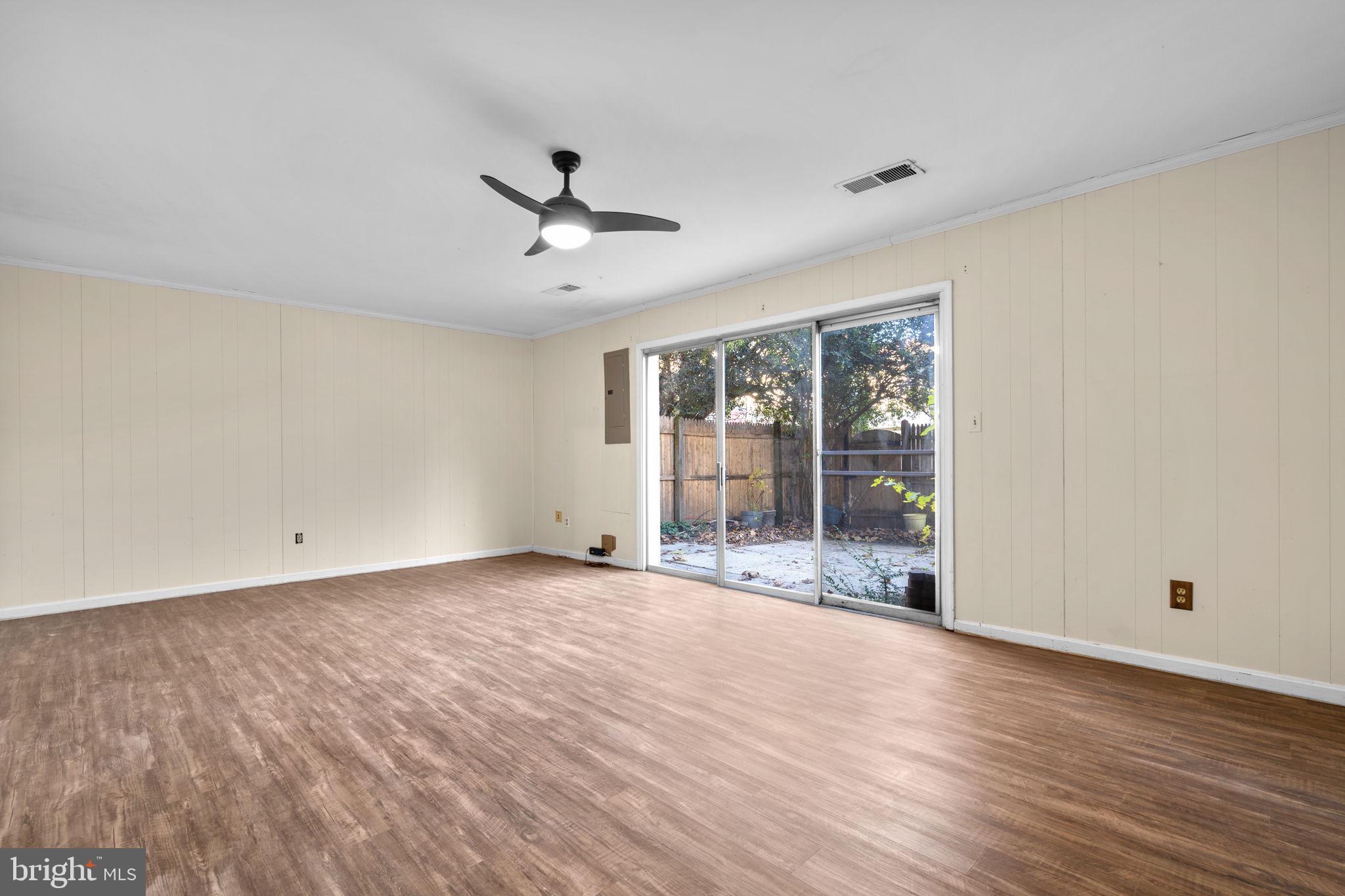 5927 Bayshire Road, Unit 115 Springfield, VA 22152 - Photo 29 of 55 a view of empty room with wooden floor and fan