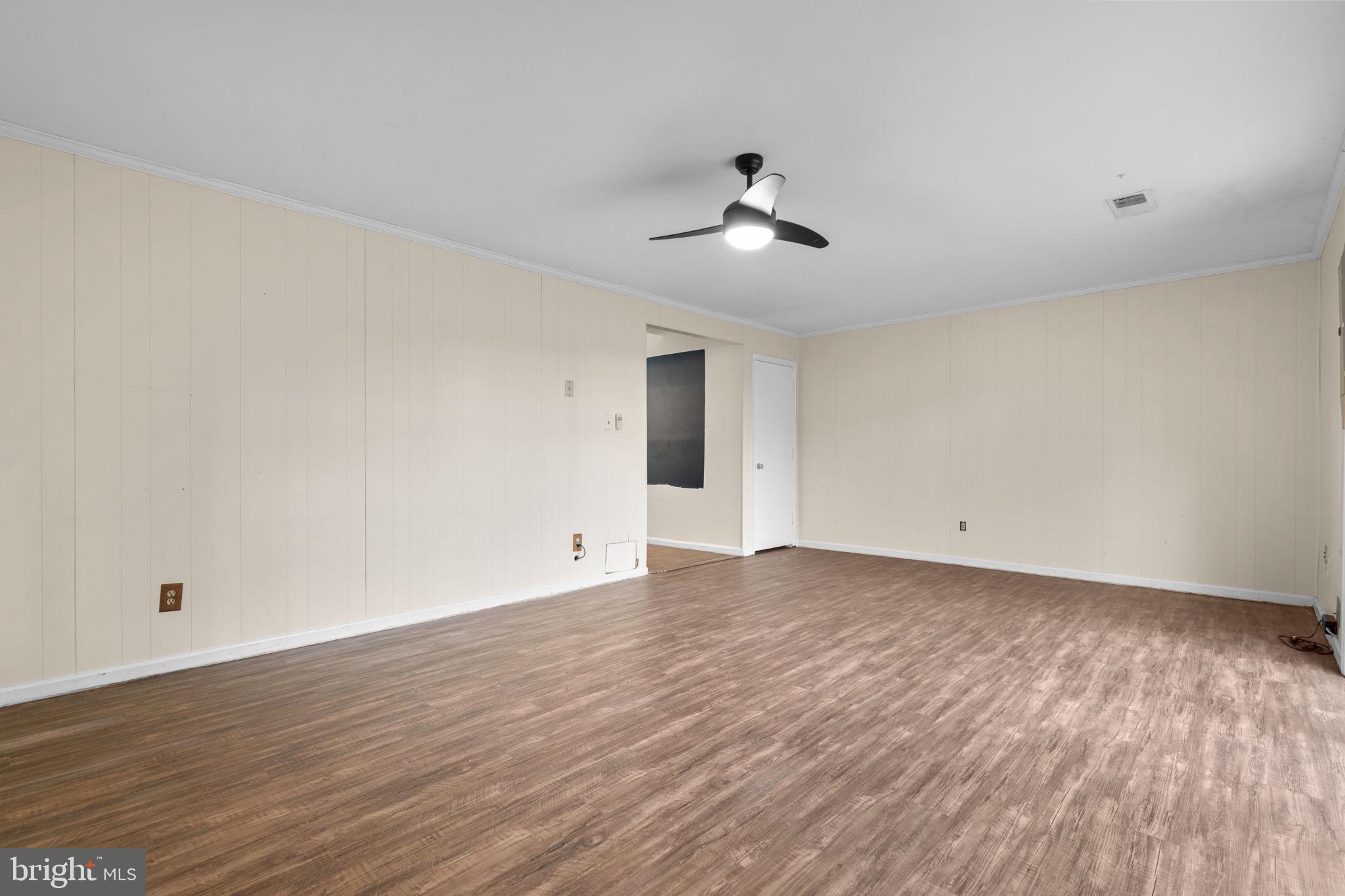 5927 Bayshire Road, Unit 115 Springfield, VA 22152 - Photo 30 of 55 a view of an empty room with wooden floor