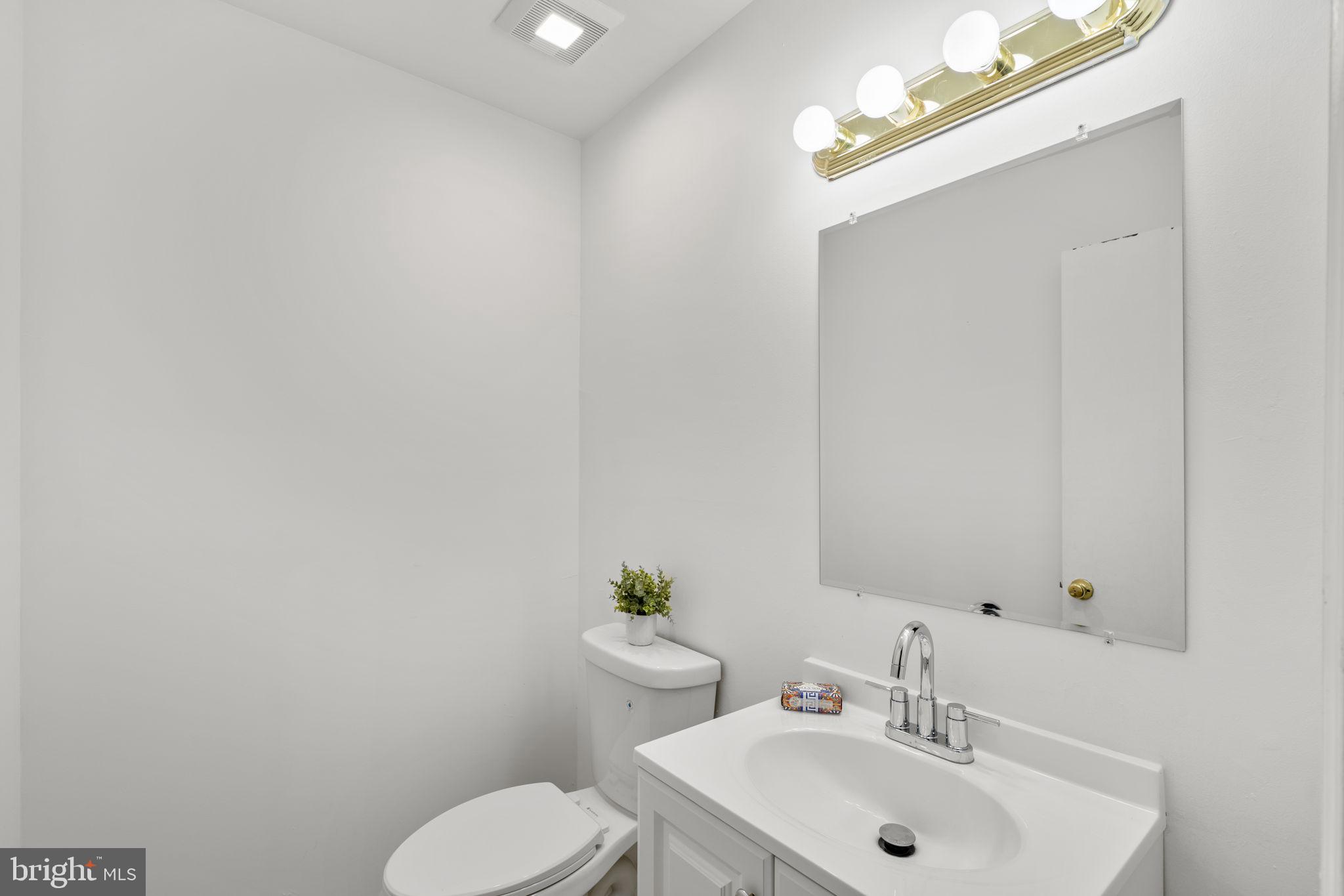 5927 Bayshire Road, Unit 115 Springfield, VA 22152 - Photo 32 of 55 a bathroom with a sink mirror and toilet